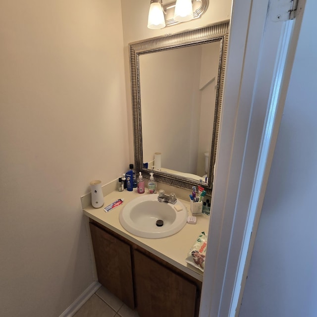 bathroom featuring vanity, tile patterned floors, and toilet