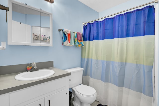 full bath with a shower with curtain, toilet, and vanity