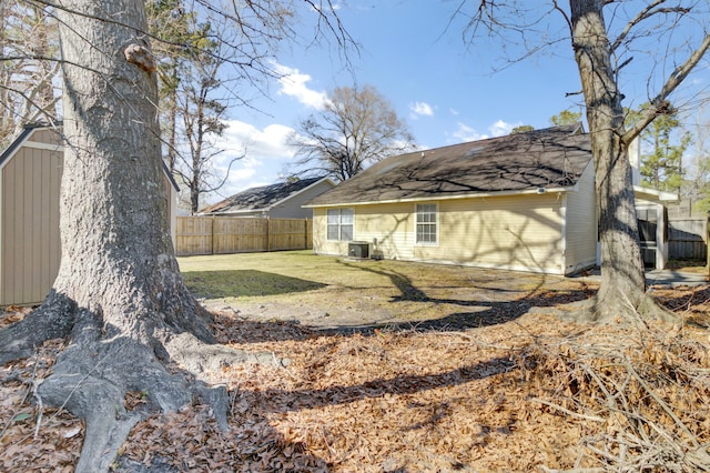 exterior space featuring cooling unit and a fenced backyard