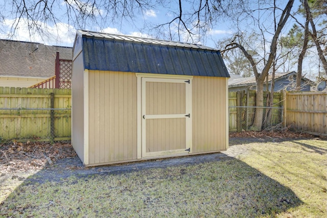 view of shed with a fenced backyard