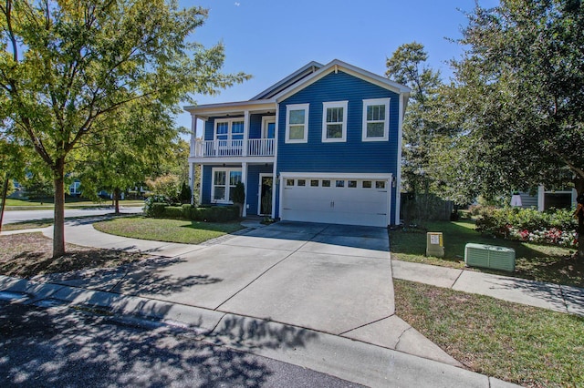 3306 Hartwell St, Johns Island, SC 29455 - view of front of property featuring a balcony, a garage, a front yard, and concrete driveway