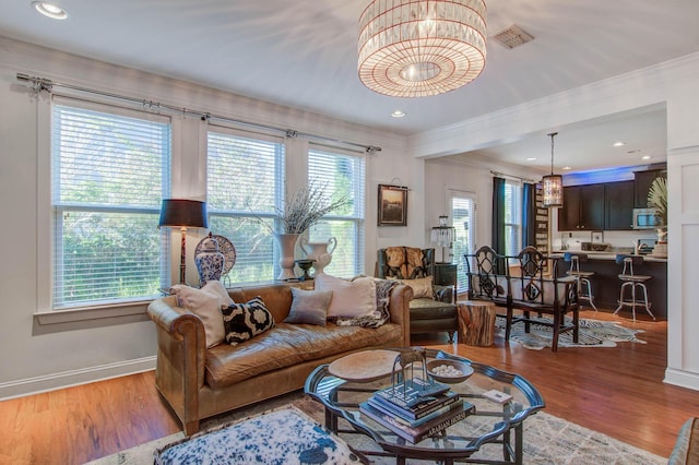 3306 Hartwell St, Johns Island, SC 29455 - living area featuring crown molding, wood finished floors, baseboards, and recessed lighting