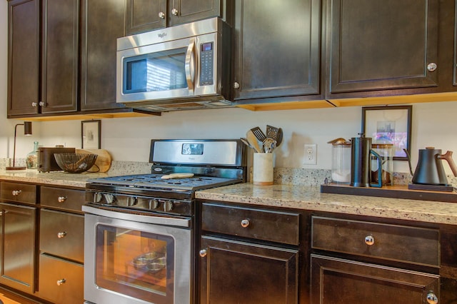 3306 Hartwell St, Johns Island, SC 29455 - kitchen featuring stainless steel appliances, dark brown cabinets, and light stone counters