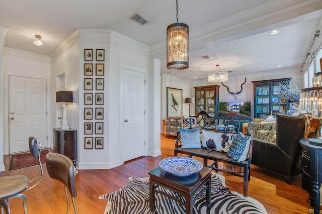 3306 Hartwell St, Johns Island, SC 29455 - living area with a chandelier, wood finished floors, baseboards, recessed lighting, and crown molding