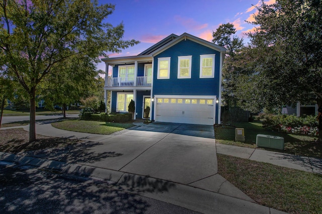 3306 Hartwell St, Johns Island, SC 29455 - view of front of property with a garage, a lawn, driveway, and a balcony