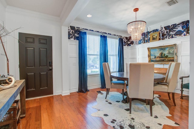 3306 Hartwell St, Johns Island, SC 29455 - dining area with crown molding, a chandelier, baseboards, and wood finished floors