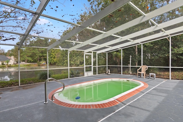 outdoor pool featuring a lanai and a patio area