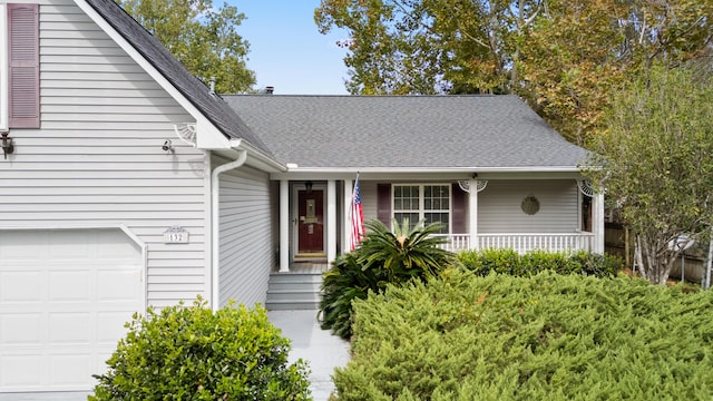 view of front facade featuring a porch, roof with shingles, and an attached garage