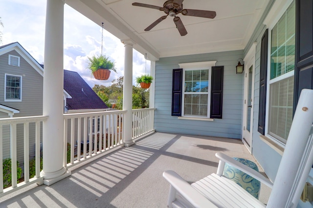 balcony with a porch and ceiling fan