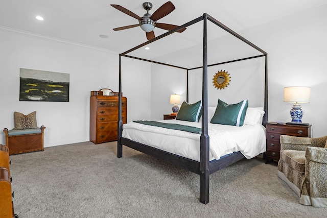 bedroom featuring ornamental molding, light carpet, and ceiling fan