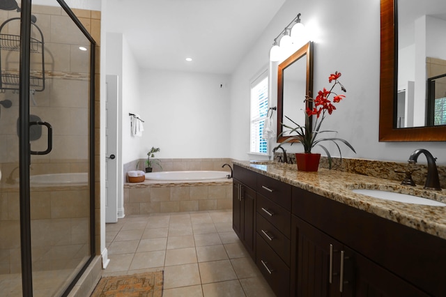 bathroom with vanity, tile patterned floors, and independent shower and bath