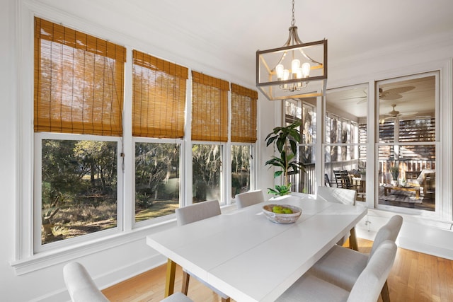 sunroom with an inviting chandelier