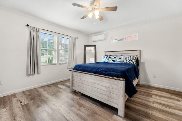 bedroom featuring hardwood / wood-style floors, ceiling fan, an AC wall unit, and crown molding