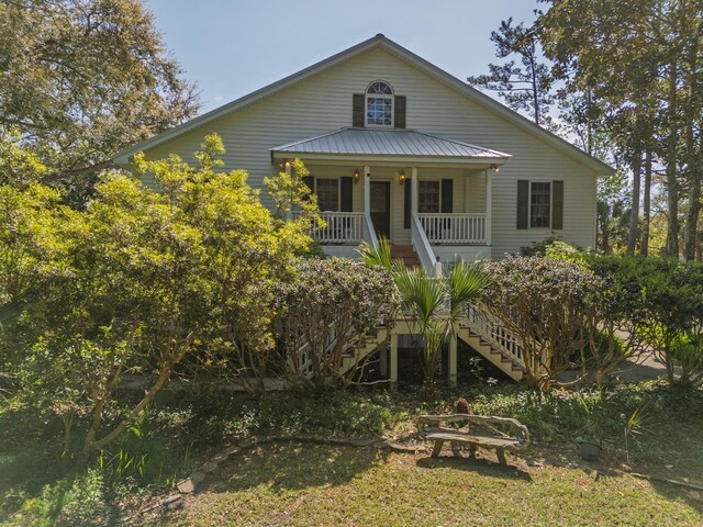 8551 Pope Landing Rd, Edisto Island, SC 29438 - bungalow-style home featuring stairs and covered porch