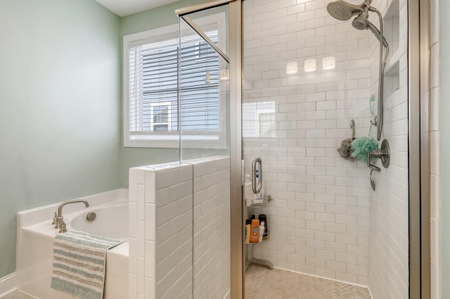 bathroom featuring parquet floors and separate shower and tub