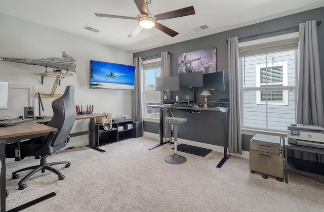 office area featuring ceiling fan and light colored carpet