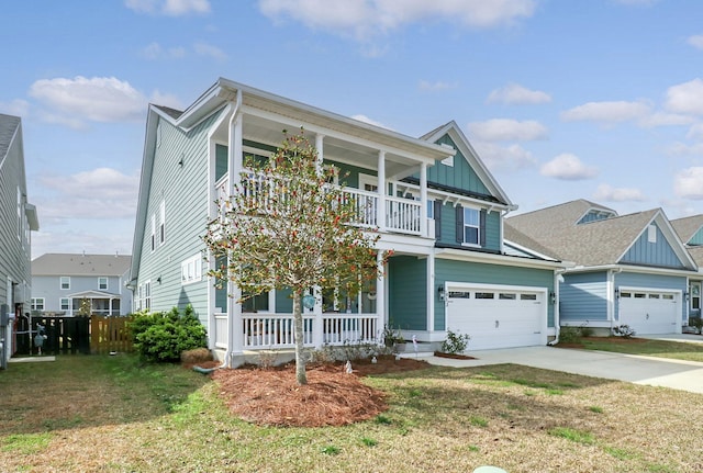 view of front of house featuring a front yard, a garage, a balcony, and a porch