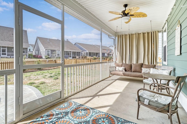 sunroom / solarium with ceiling fan