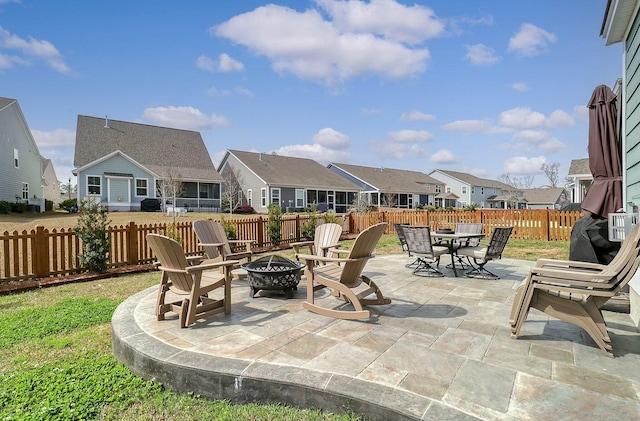 view of terrace featuring an outdoor fire pit