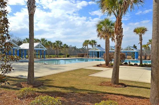 view of pool with a yard and a gazebo