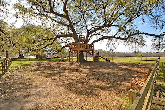 view of yard featuring a playground and a rural view