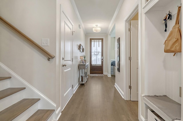 interior space with hardwood / wood-style floors and ornamental molding