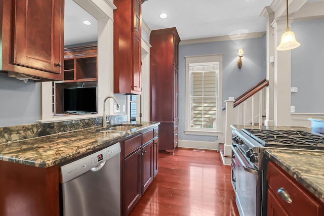 183 Ionsborough St, Mount Pleasant, SC 29464 - kitchen with stainless steel appliances, reddish brown cabinets, dark wood-style floors, dark stone counters, and recessed lighting
