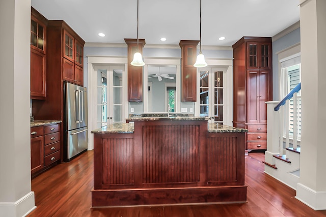 183 Ionsborough St, Mount Pleasant, SC 29464 - kitchen featuring stainless steel fridge, dark wood-style floors, a ceiling fan, glass insert cabinets, and light stone countertops