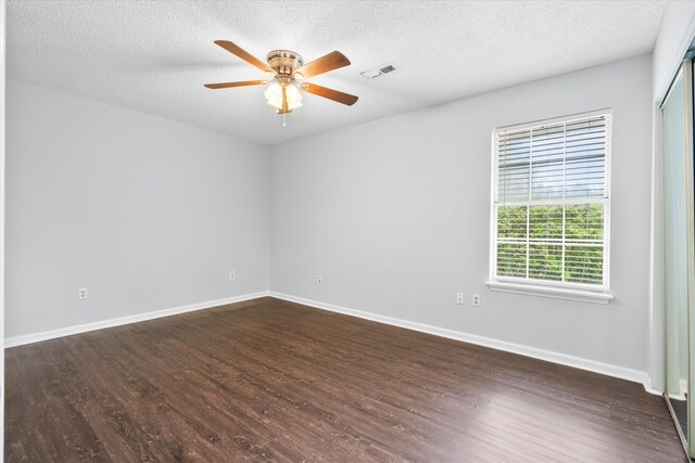 7813 Sandida Ct, North Charleston, SC 29418 - empty room featuring dark wood-style flooring, ceiling fan, baseboards, and a textured ceiling