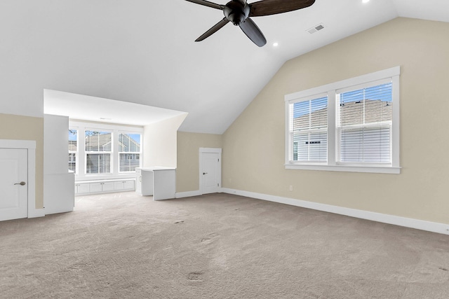 additional living space featuring lofted ceiling, light colored carpet, and ceiling fan