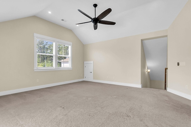 additional living space with ceiling fan, lofted ceiling, and carpet floors