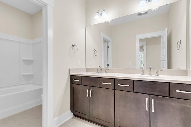 full bathroom with vanity, toilet, tile patterned floors, and shower / tub combination