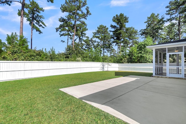 view of yard featuring a patio area and a sunroom