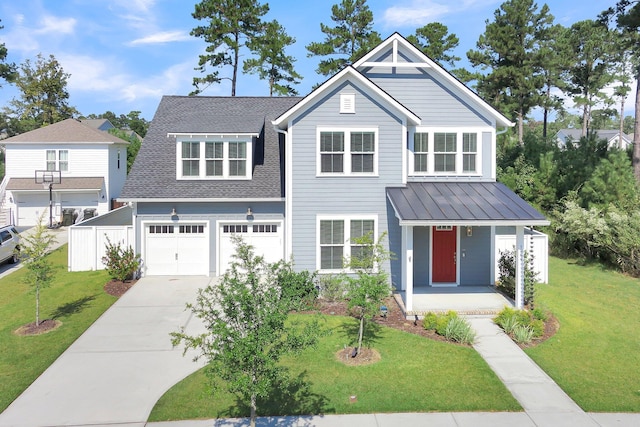 view of front of property featuring a porch, a garage, and a front yard