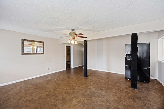 empty room featuring a textured ceiling and ceiling fan