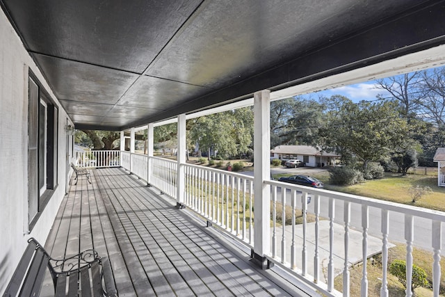 wooden terrace with a porch