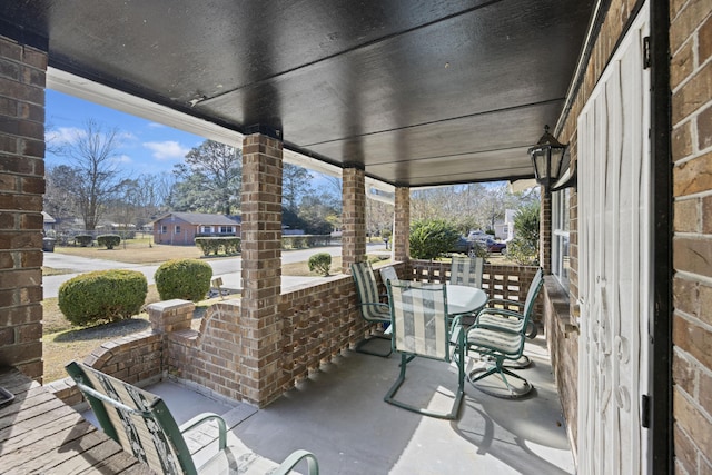 view of patio featuring a porch