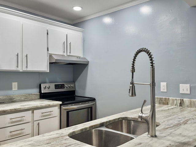 10 Stallion Ct, Charleston, SC 29407 - kitchen with under cabinet range hood, stainless steel electric range oven, white cabinets, light stone countertops, and crown molding