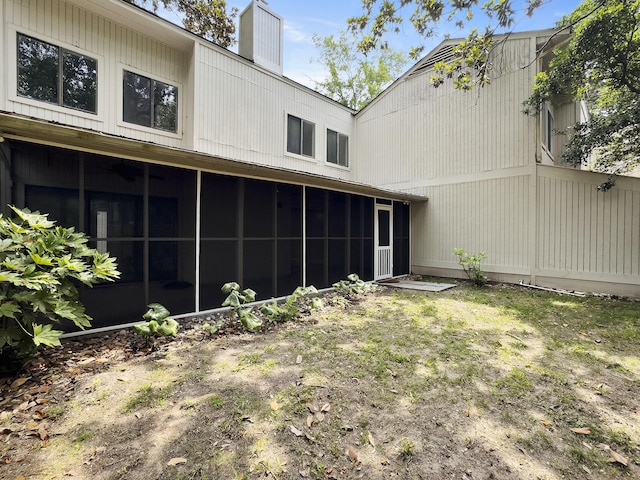 10 Stallion Ct, Charleston, SC 29407 - back of house featuring a sunroom and a chimney