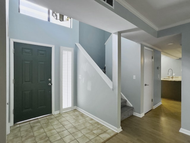10 Stallion Ct, Charleston, SC 29407 - entryway featuring crown molding, stairs, and wood finished floors
