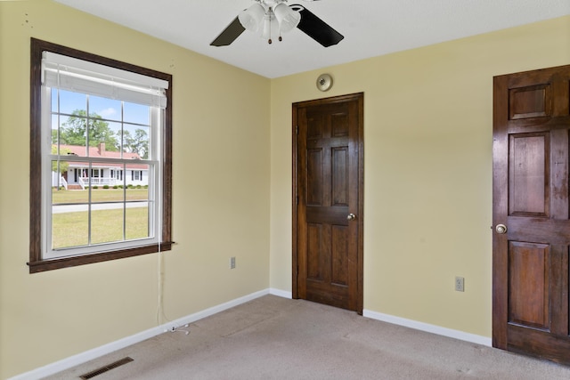 4097 NE Brown St, Orangeburg, SC 29118 - unfurnished bedroom featuring light colored carpet, baseboards, and a ceiling fan