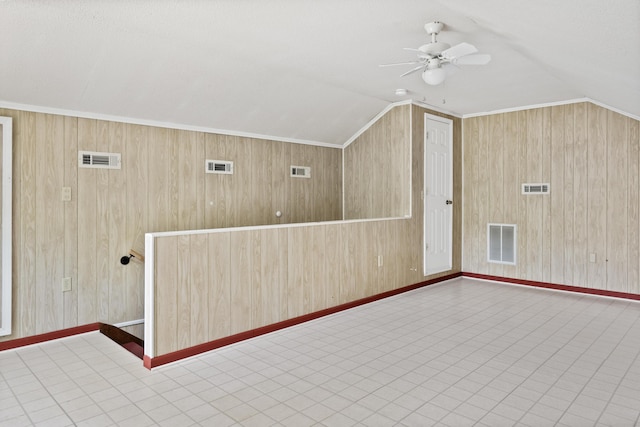 4097 NE Brown St, Orangeburg, SC 29118 - additional living space featuring vaulted ceiling, ceiling fan, wood walls, tile patterned floors, and baseboards