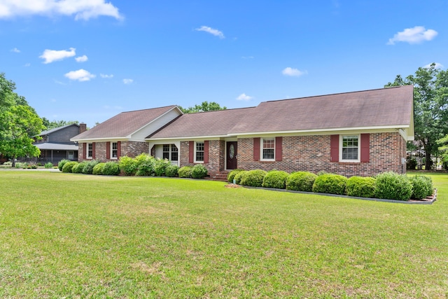 4097 NE Brown St, Orangeburg, SC 29118 - ranch-style home featuring a front lawn and brick siding