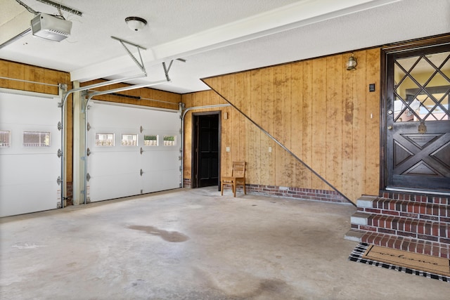 4097 NE Brown St, Orangeburg, SC 29118 - garage with a garage door opener and wooden walls