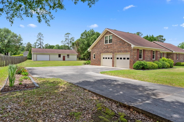 4097 NE Brown St, Orangeburg, SC 29118 - view of front facade featuring concrete driveway and brick siding