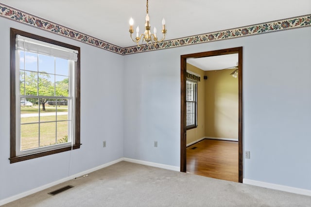 4097 NE Brown St, Orangeburg, SC 29118 - carpeted empty room with a chandelier and baseboards
