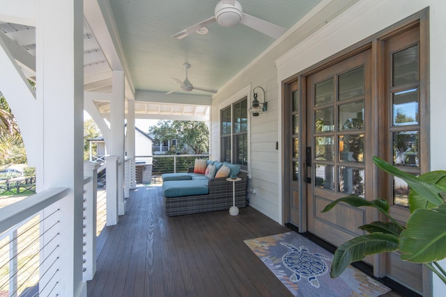 deck with ceiling fan and a porch