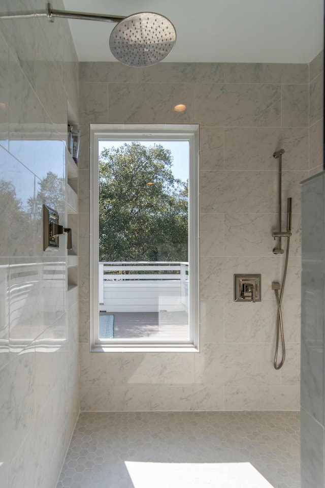 bathroom with tiled shower