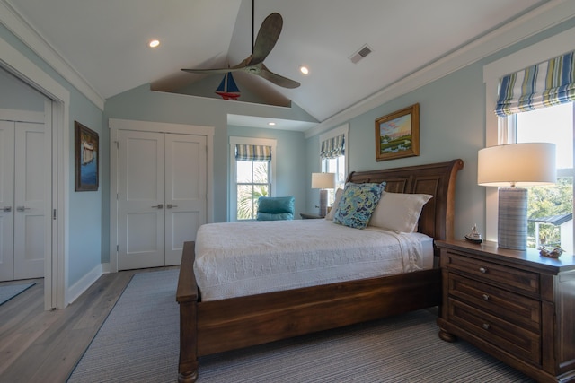 bedroom featuring lofted ceiling, recessed lighting, visible vents, ceiling fan, and wood finished floors