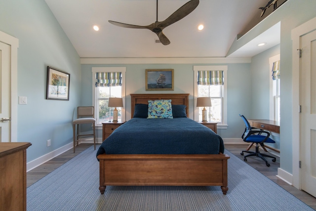 bedroom featuring lofted ceiling, ceiling fan, recessed lighting, wood finished floors, and baseboards